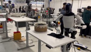 Elon's Tesla robot is sort of 'ok' at folding laundry in pre-scripted demo